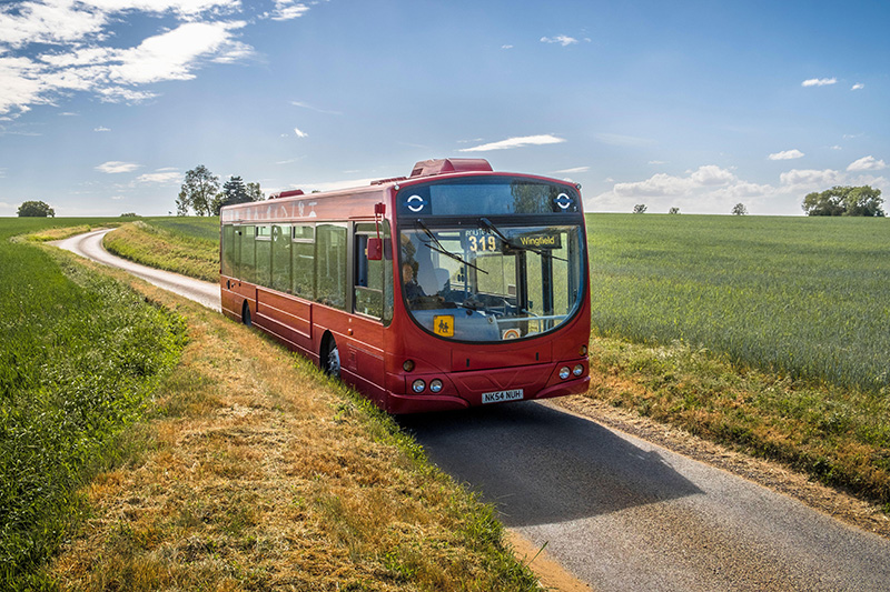 Red bus country lane